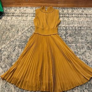 Yellow pleated dress